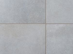 Tegels in pure klei betonlook met voegen uit de buurt
